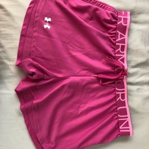 Bright pink Underarmour running shorts